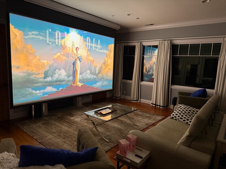 Theater/family room: 180-inch movie theater with laser projector and Dolby surround sound. - 115 Inez Pl