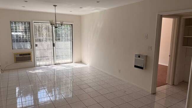 bright natural light with private patio access - 7617 De Longpre Ave