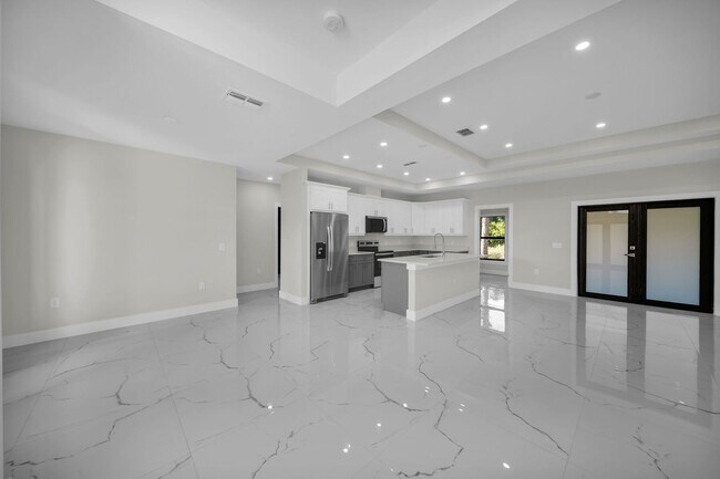 Building Photo - Brand-New Home in Lehigh Acres – Move-In Ready! FL 33974. Qualify for a deposit-free option and s...
