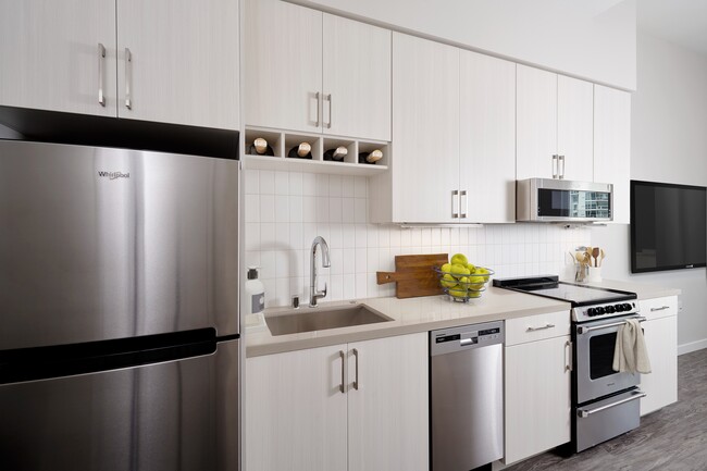 Stainless steel appliances, quartz countertops and wine storage - Modera Jack London Square