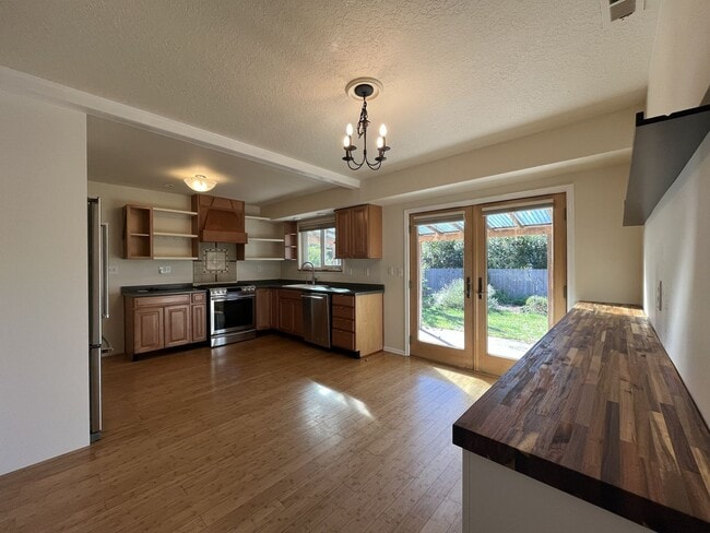 Building Photo - Light-Filled Home with Open Layout, Modern...