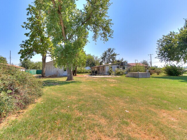 Building Photo - 9706 N Garnett Dr