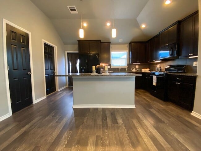 Building Photo - WELCOME TO YOUR CHARMING HOME AT THE COTTA...