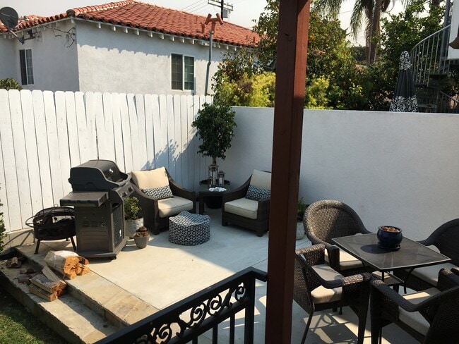Paved sitting area - 974 W 20th St