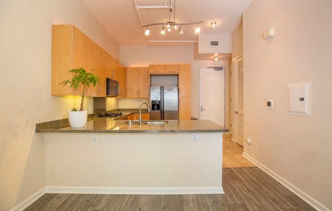 Building Photo - Modern Condo Retreat in the Vibrant M2i Co...