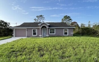 Building Photo - 3/2/1 Single Family Home Available – Cozy,...
