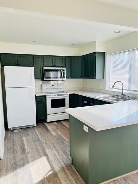 Newly remodeled kitchen with ample storage and pantry. - 1200 Olney Ave SE