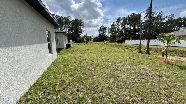 Building Photo - Smart & Stylish 3BD/2BA Palm Bay Home – Modern Upgrades, No Water Bills!
