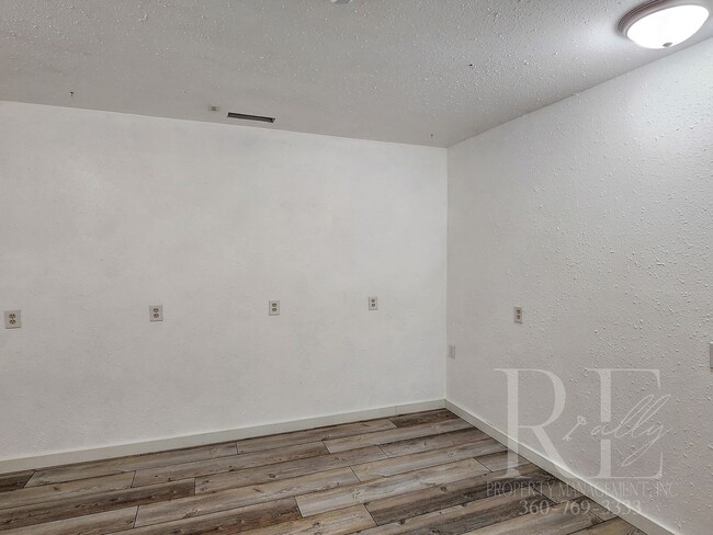 Building Photo - Vaulted Ceilings, Unique Designer Kitchen & Expansive Half-Acre Setting with Flexible Living Spaces