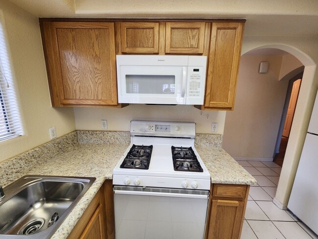 Building Photo - 2nd Story Condo in gated community close to the pool.