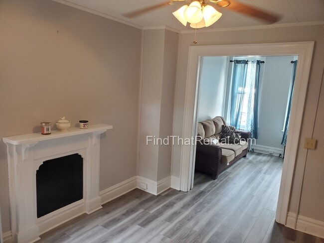 Building Photo - Charming Historic Retreat with Private Fenced Yard & Parking – Prime Downtown Location