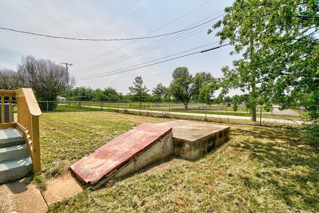 Building Photo - 3BR Home in Shawnee with Stainless Appliances, Fenced Yard & Storm Shelter!