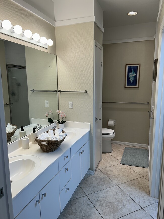 Primary Bathroom includes a double-sided walk-in closet - 3235 Cypress Glen Way