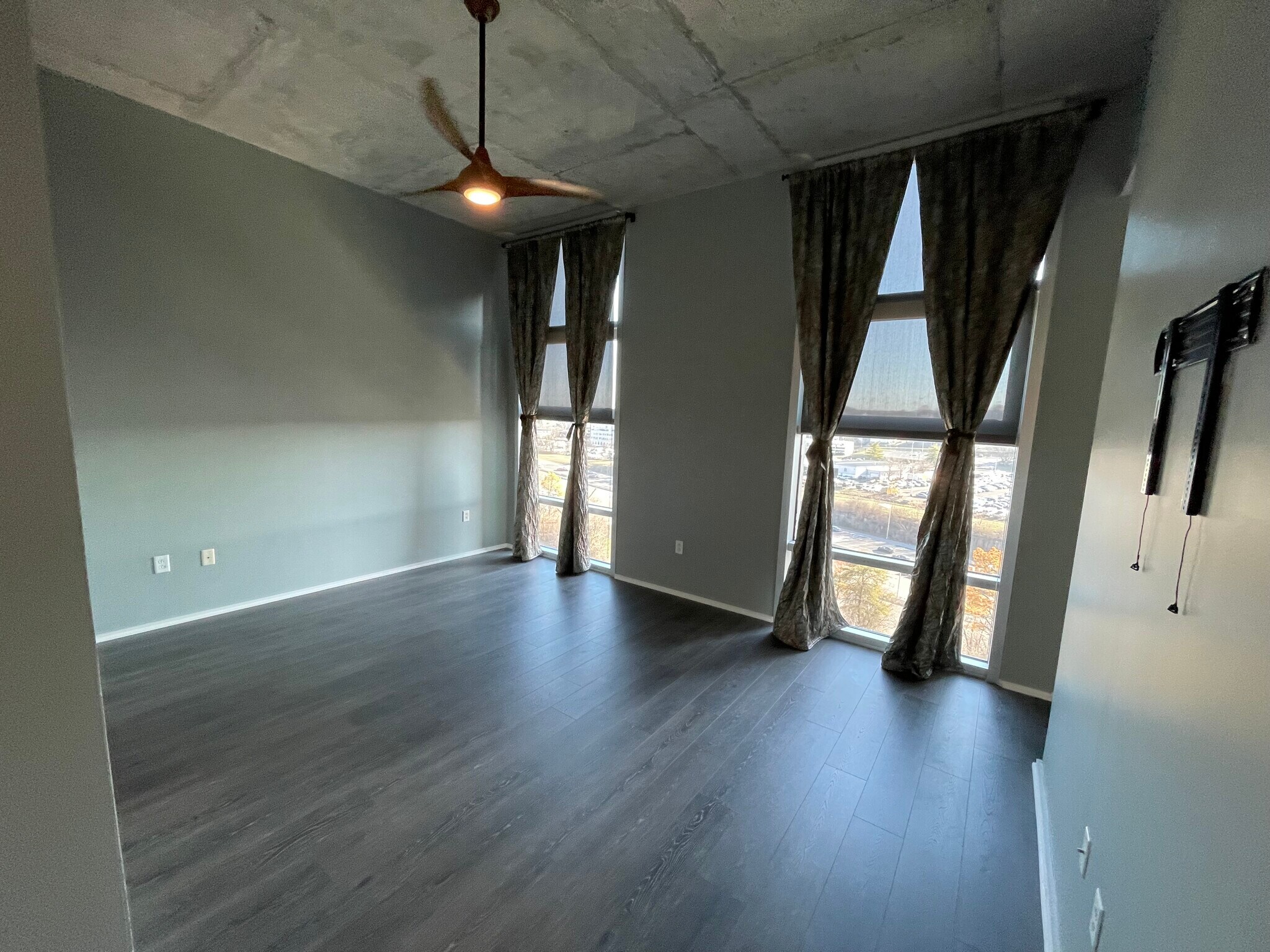 Full wall windows with beautiful curtains and black out shades. - 700 12th Ave S