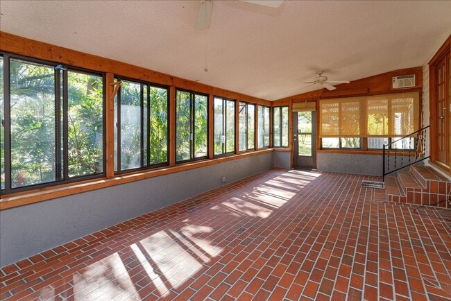 Building Photo - Run don't walk for this one of a kind beautifully maintained Old Florida Charmer on a park like d...