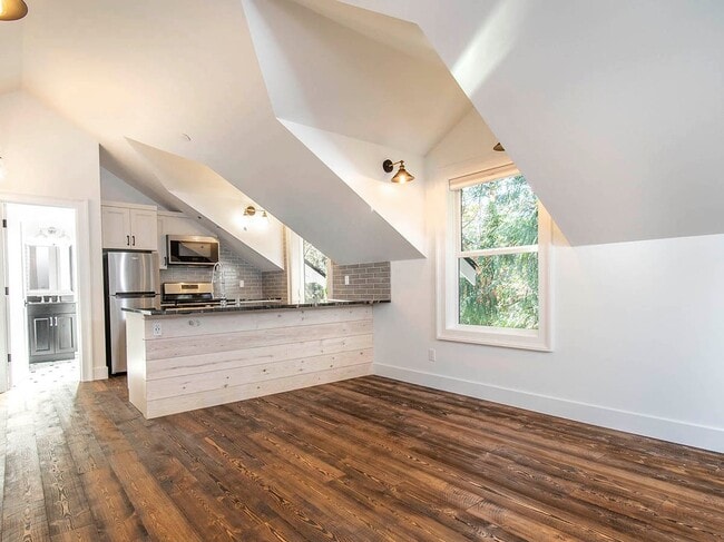 Building Photo - Expansive Loft-Style Carriage House in Private Haller Lake Estate