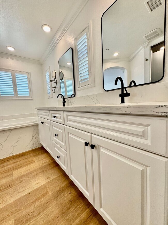 Building Photo - Beautifully Remodel Townhouse with AC & Two Car Garage!