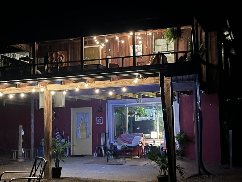 Back view of cover porch and lower level space - 3393 Mobile Rd