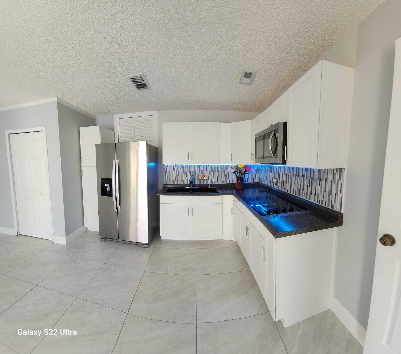 Kitchen and laundry room - 202 Bramley Ct