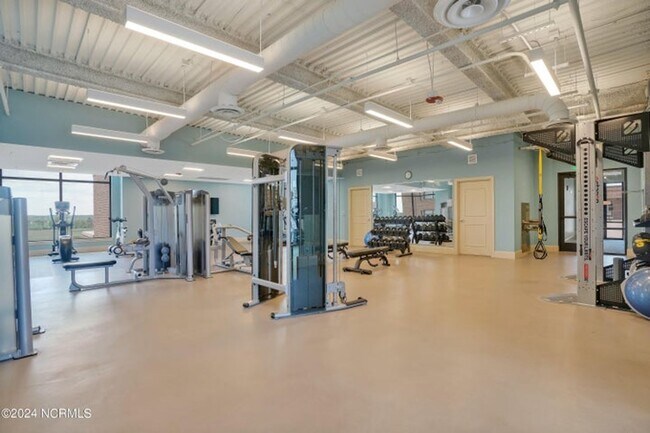 Building Photo - Welcome to your dream condo in the heart o...