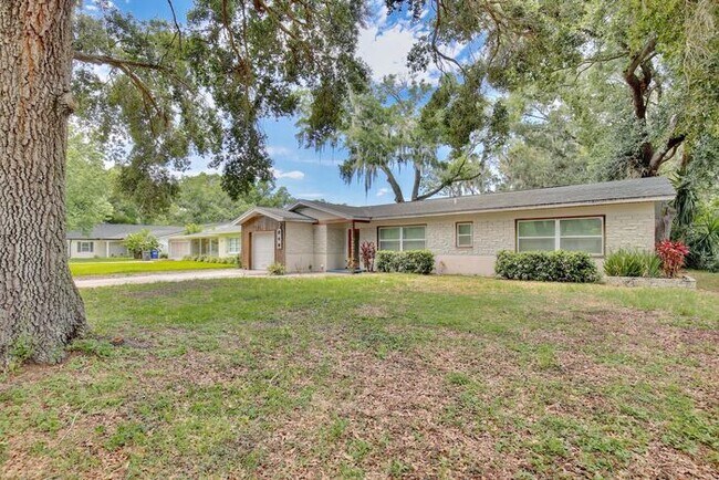 Building Photo - Gorgeous Waterfront 3/2 Mid-century Modern Style Home with a Covered Patio and a Large Backyard i...