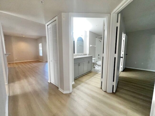Building Photo - NEW-Remodeled bathroom & kitchen! NEW VINYL PLANK flooring & fresh paint! 2 bedroom 1 bath condo ...