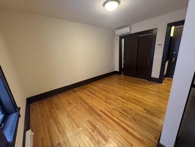 Building Photo - "Charming Studio Retreat with Hardwood Elegance in Downtown Minneapolis!"