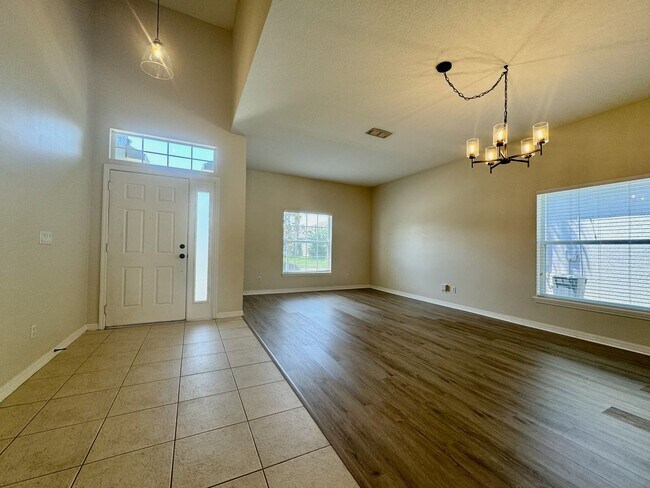 Building Photo - Beautiful 3/2 home near Lake Nona ~ Fenced In Yard ~ LVP & Tile Flooring ~ Community Pool!