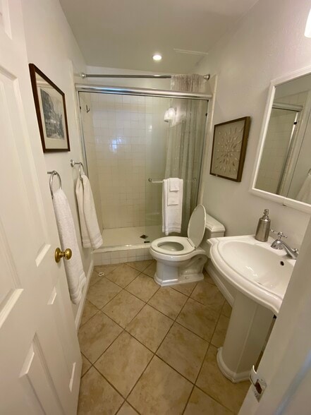 Downstairs bathroom. Has been upgraded with new floor and tile. - 1845 Anaheim Ave