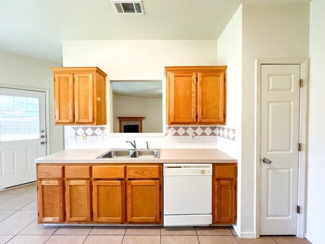 Building Photo - Available NOW!!!! Open floor plan features living room with fireplace, dining area, and large kit...