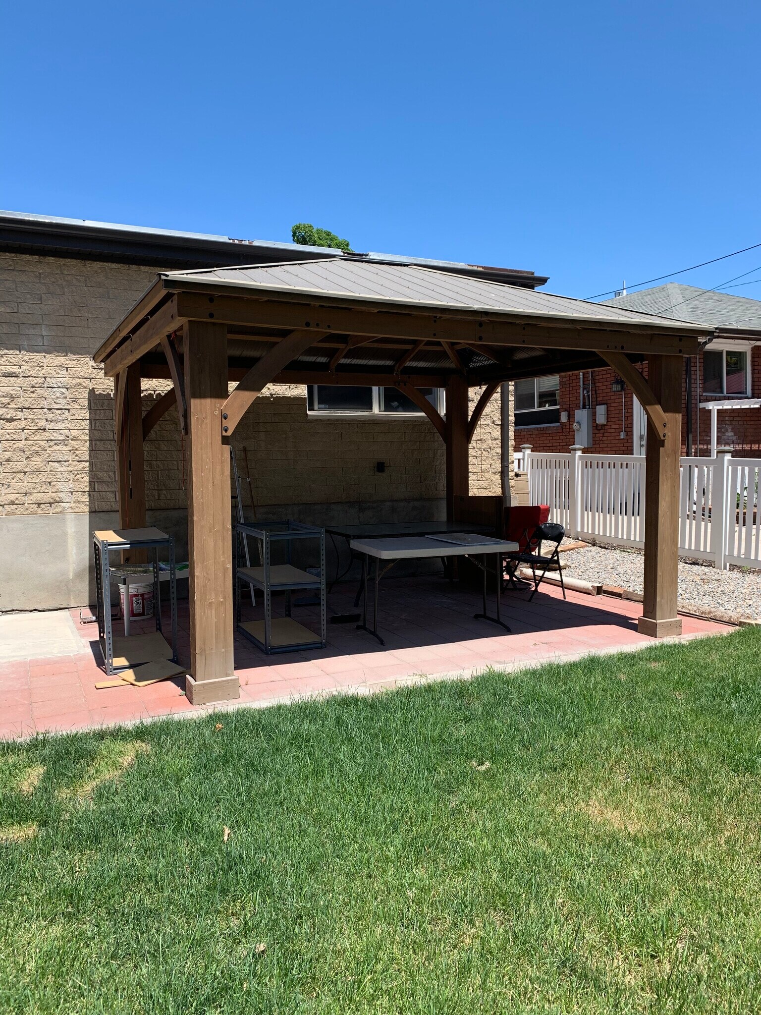 Backyard covered patio with roll down shades perfect for BBQing and hanging out. - 544 Wilmington Ave