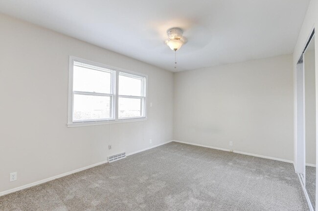 Building Photo - Split-Level Home With Fenced Yard In Quiet Residential Area