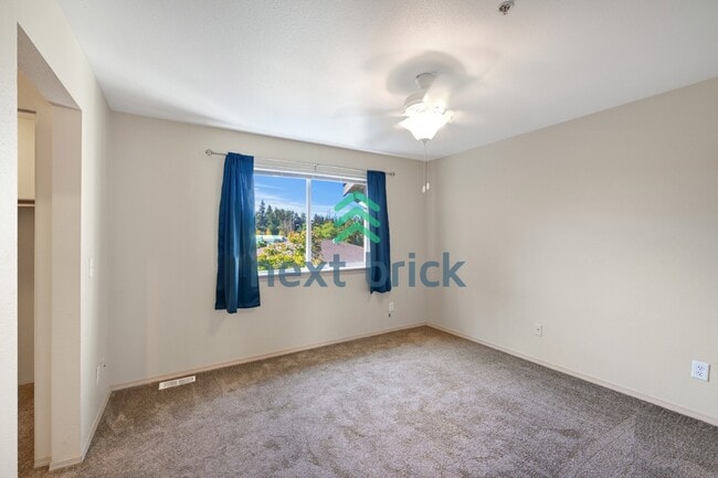 Building Photo - Spacious 3-Level Condo with 2-Car Garage, Mt. Rainier Views & Turnkey Comfort in Bonney Lake