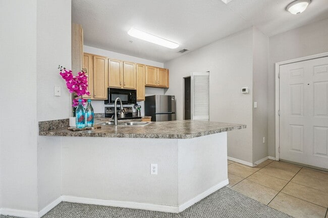 Building Photo - Elegant 1-Bedroom Condo with Lakeside Views in Resort-Style Community