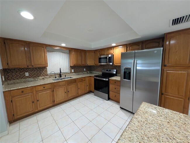 Building Photo - 6947 Bottle Brush Dr