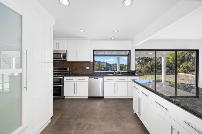 Building Photo - Modern Elegance Above the Greens: Premier Via Verde Estate with Panoramic Views