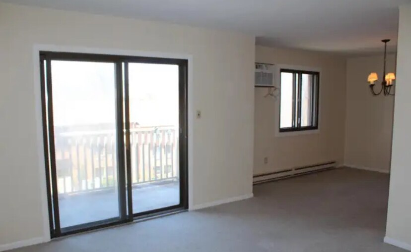 Living room/dining room (has had new vinyl plank flooring since photos taken) - 500 Campbell Cir