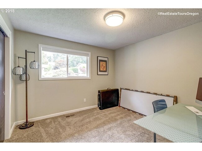 Building Photo - Spacious 4-Bedroom Home with Multiple Livi...