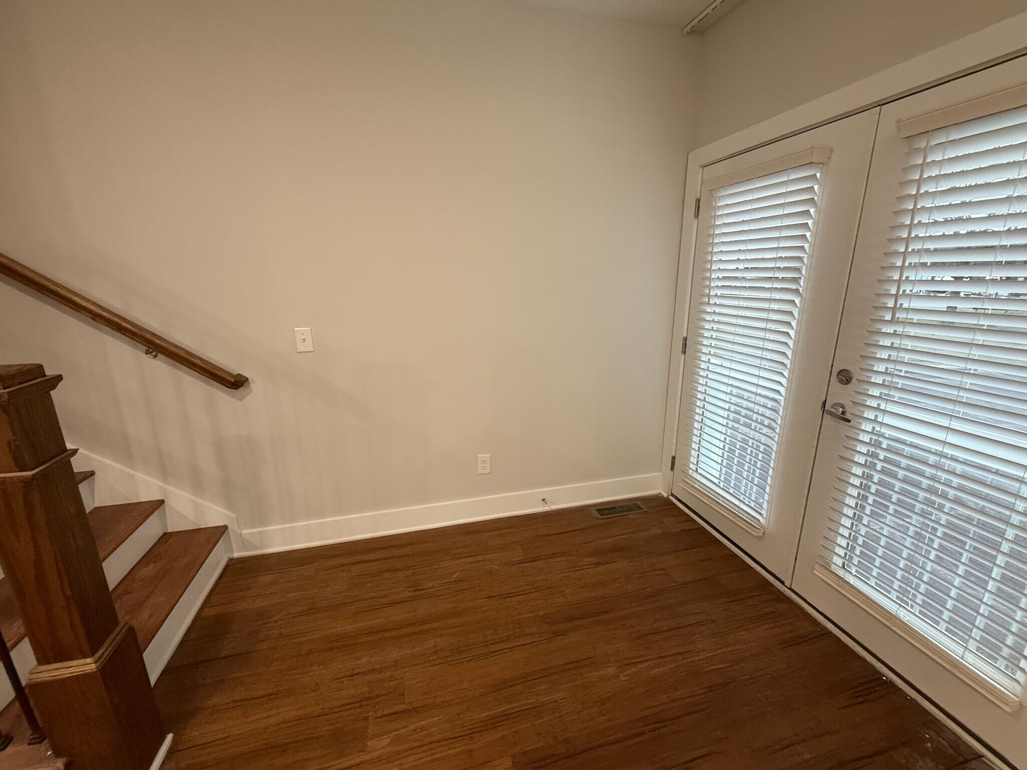 Dining Nook: Dining area beside the living room with French doors that bring in natural light. - 421 Elysian Fields Rd