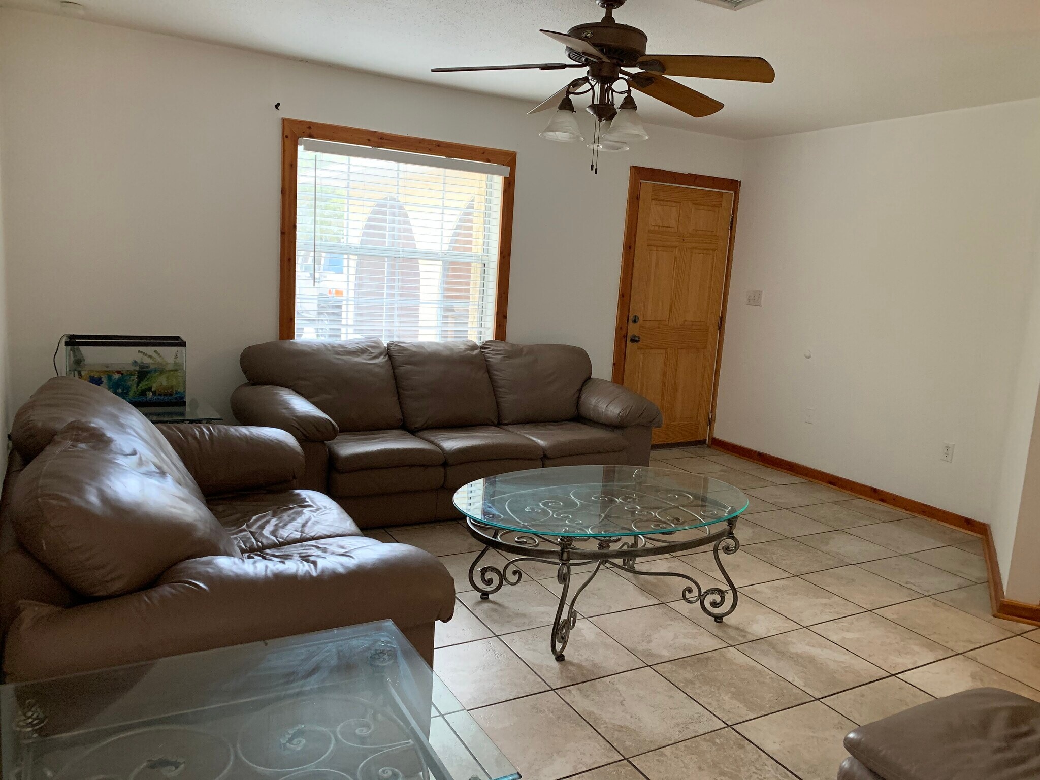 Family room. - 4911 23RD ST W, #A