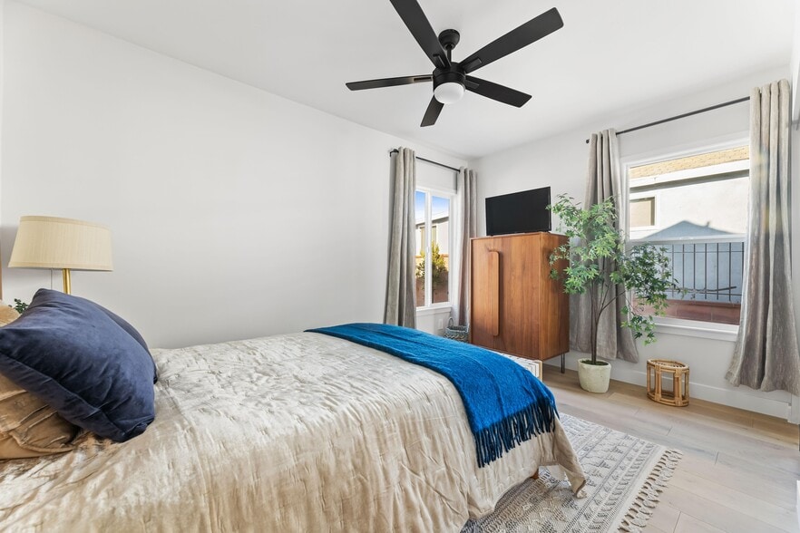 2nd bedroom with large closet, West Elm furniture, and flat screen TV. - 1823 N Ditman Ave