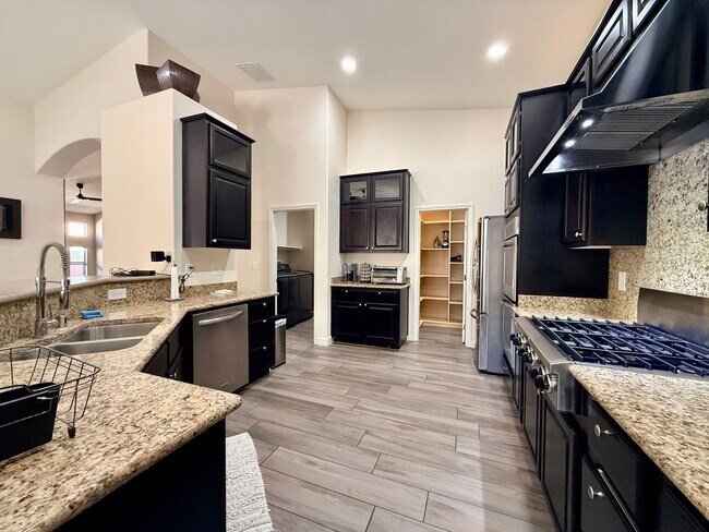 Building Photo - Welcome to this stunning 5-bedroom, 3-bath home located in the desirable Estates of Wigwam Ranch ...