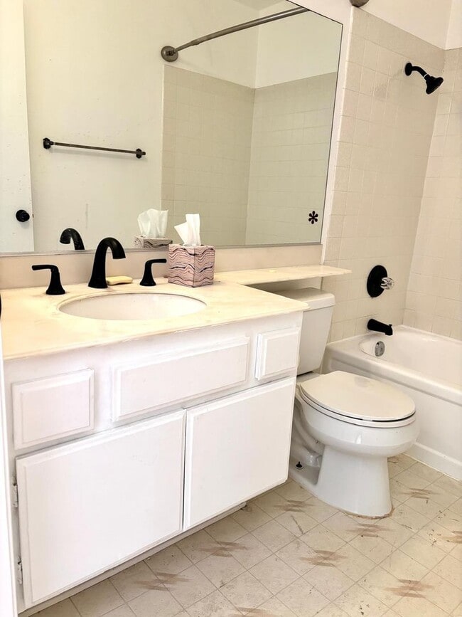 Building Photo - Available Now is a Condo style Townhouse i...