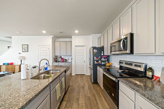 Building Photo - Stylish 4-Bedroom Home with Solar & Game R...