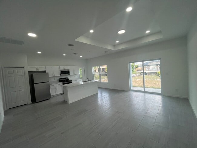 Building Photo - New 4 Bed / 2 Bath / 2 Car Garage Family Retreat in Desirable Lehigh Acres!