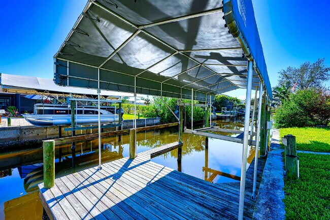 Building Photo - Waterfront Furnished Pool Home with Gulf & Canal Views in Estero Bay Shores