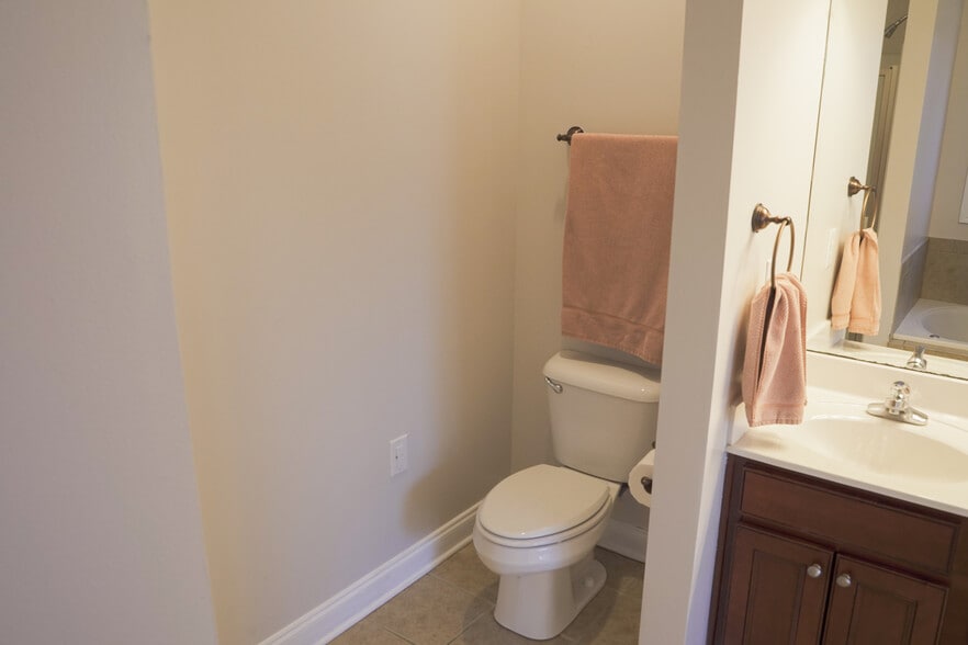Primary Bath Walled Toilet and Sink. Has its own light and fan. (9x8) - 393 Hays Blvd