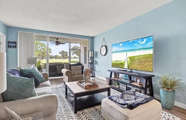 Building Photo - Annual OR Seasonal turnkey FURNISHED 2/2 ground floor condo with golf course and water views