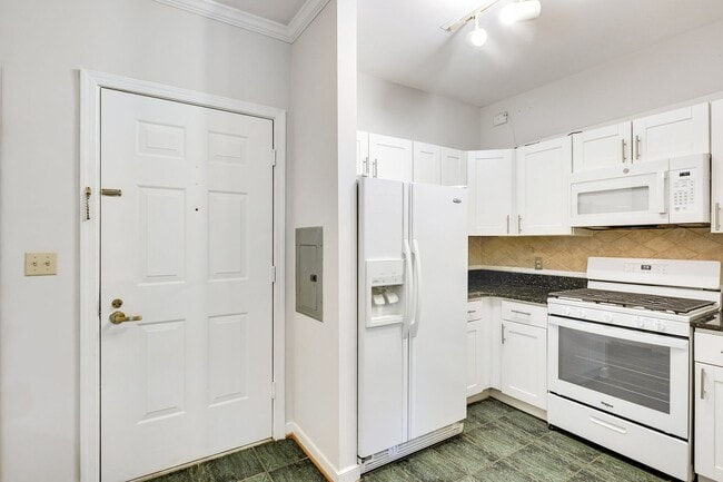 Building Photo - Ideally located near the Metro and Tysons Galleria, offering premier access to shopping, dining, ...