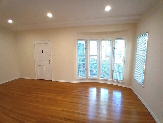 LIVING ROOM FRENCH WINDOWS - 442 S Palm Dr